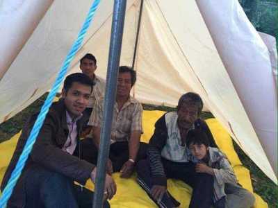 Johnatthan and team provide tents to people.
