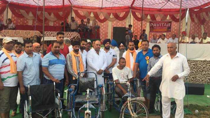 Distribution of Tricycle and Ration Card