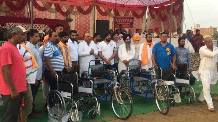 Distribution of Tricycle and Ration Card