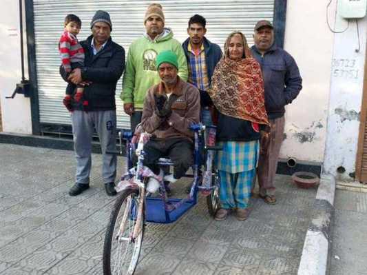 Distributed wheels chairs to Poor people